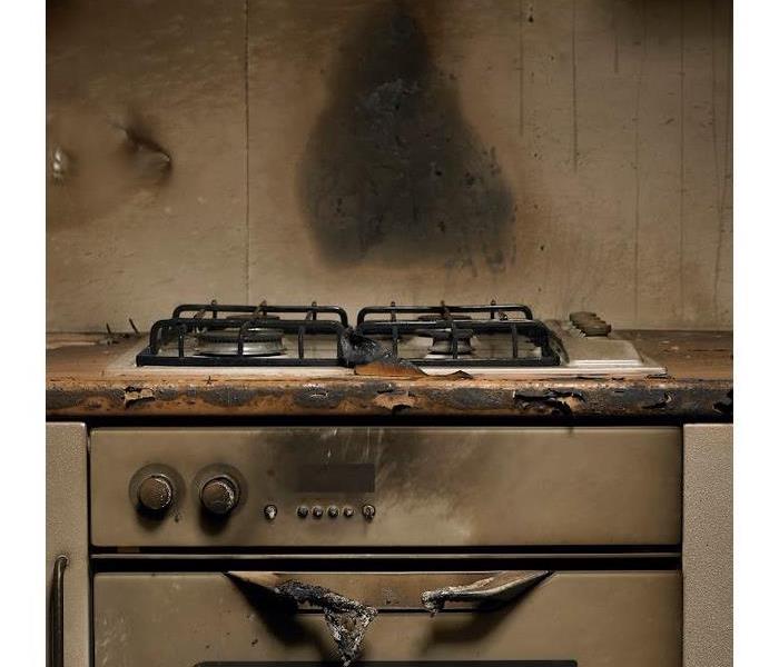 a fire damaged stove and wall